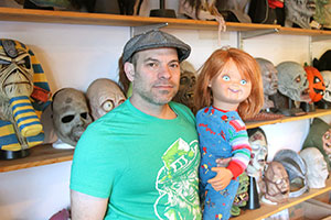 Chris Zephro with a "Chucky" doll